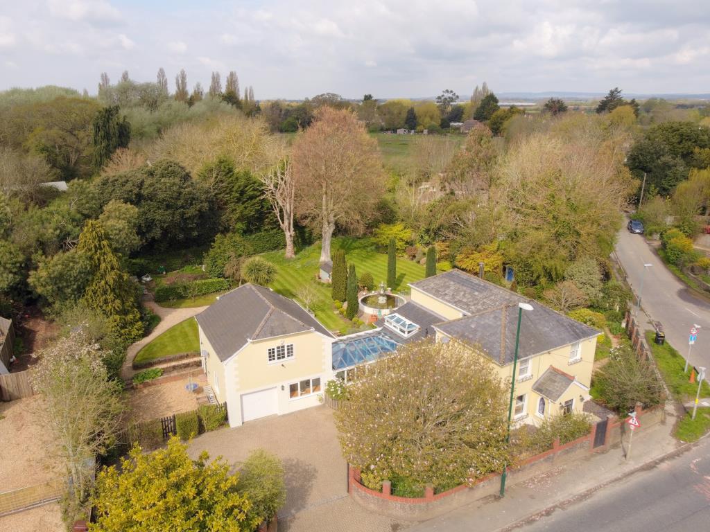 Lot: 159 - SUBSTANTIAL THREE-BEDROOM EXTENDED COTTAGE WITH SEPARATE ANNEXE - Aerial view of Early Cottage